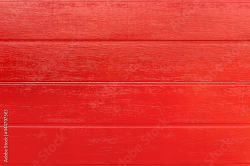 Bright red wooden planks background, horizontal boards. Red paint texture