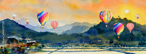 Watercolor landscape painting of hot air balloon, mountain and cornfield. photo