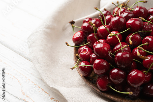 Sweet red cherry berries served on a plate isolated on white background