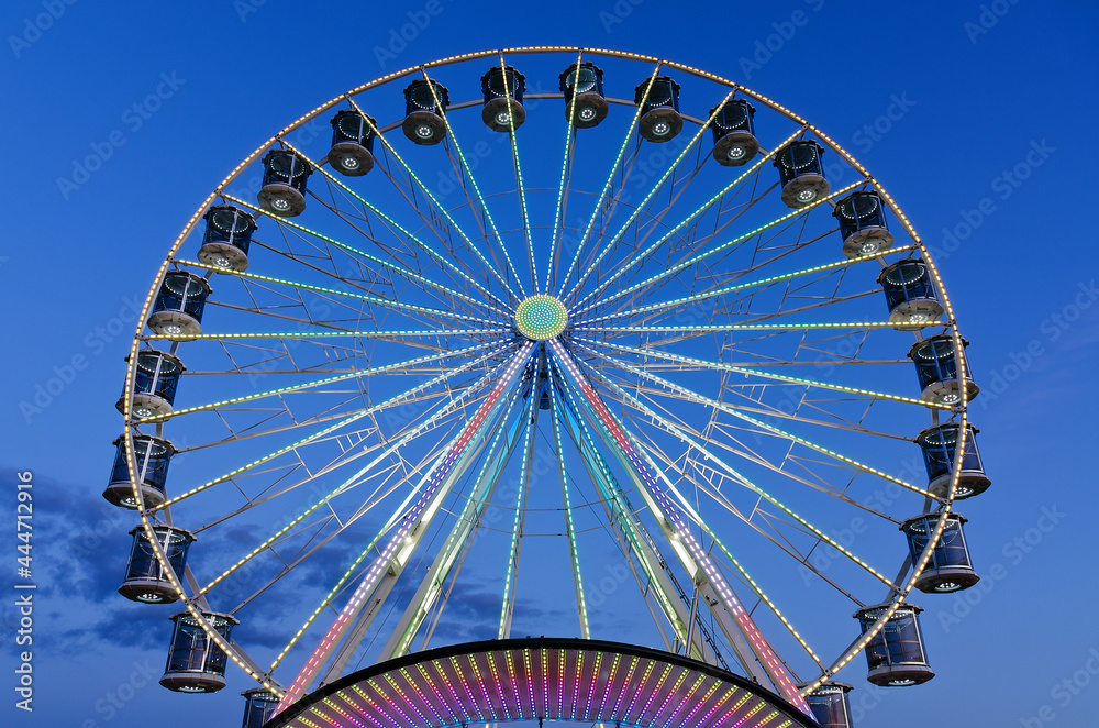 High Ferris Wheel against dark night sky in our summer vacation at Adriatic seaside. Amusement park ride. Holidays concept. High Ferris Wheel against dark night sky in our summer vacation at Adriatic seaside. Amusement park ride. Holidays concept.