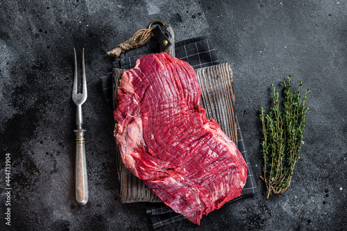 Leinwand Poster Uncooked Raw Flank or flap beef steak on butcher board