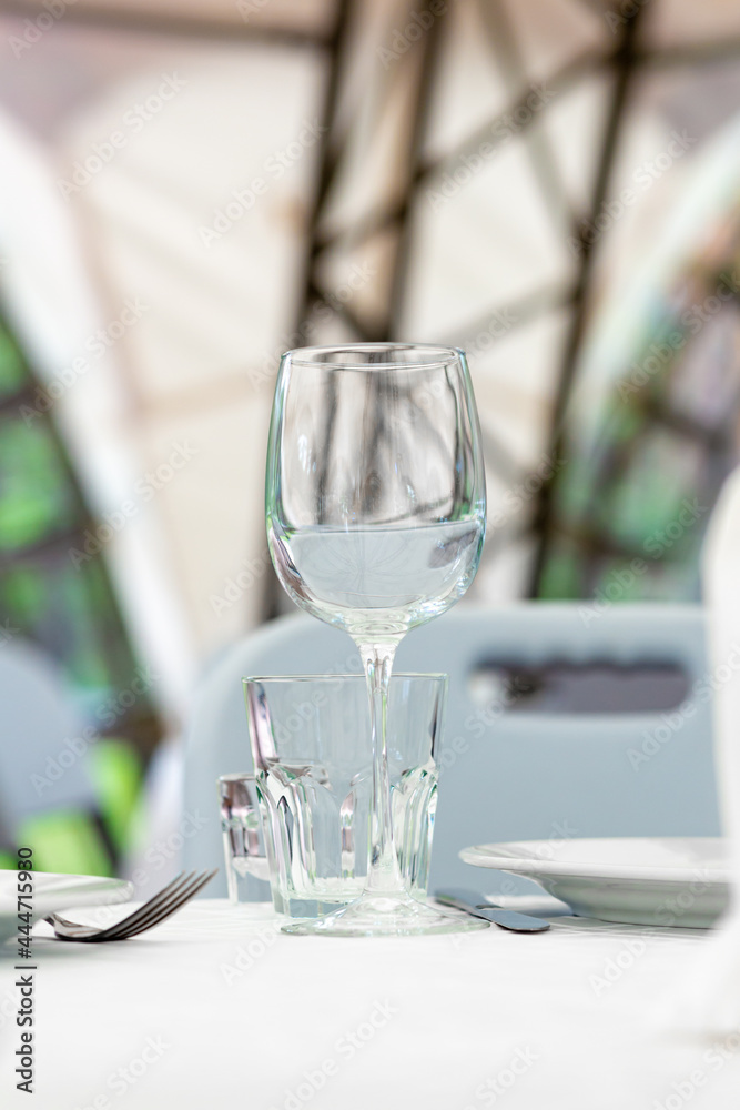 Wedding. Banquet. Table for guests, are served with cutlery and crockery and covered with a tablecloth. Wedding. Banquet. Table for guests, are served with cutlery and crockery and covered with a tablecloth.