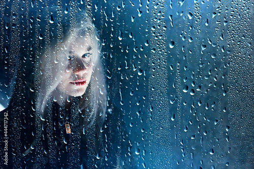 rain night street girl portrait  sad concept is waiting for one beautiful adult female
