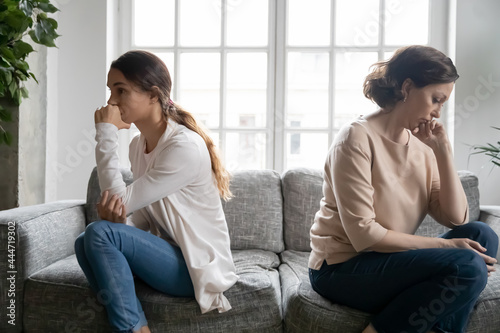 Canvastavla Upset stubborn girl and old Caucasian mom sit on sofa avoid talking after family fight
