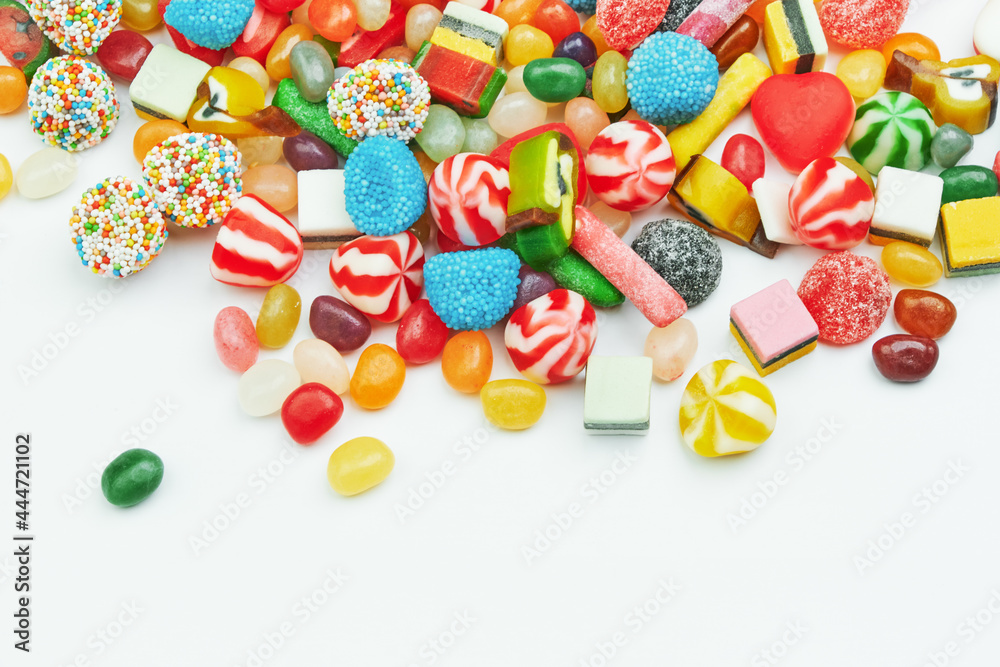 Multi-colored gummy candies on a white background. Festive backdrop
