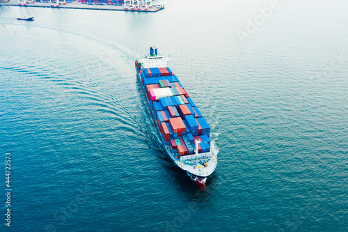 Aerial view Cargo container ship. Business logistic transportation  in the ocean ship carrying container,Cargo ship, Cargo container in factory harbor for import-export  © AU USAnakul+