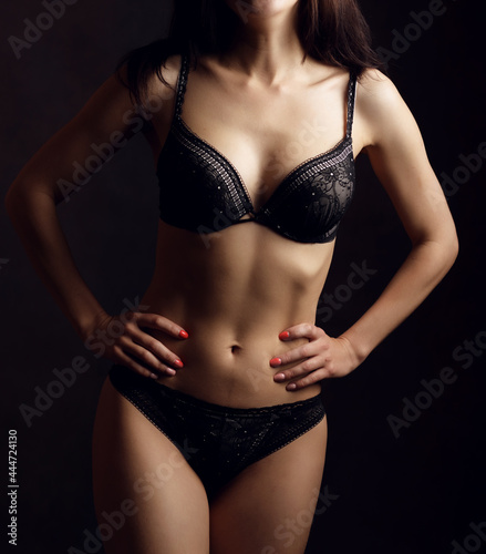 Sensual adult woman in black underwear. Studio shot.