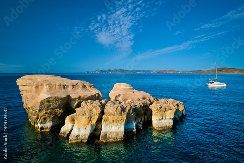 Yacht boat at Sarakiniko Beach in Aegean sea, Milos island , Greece photo