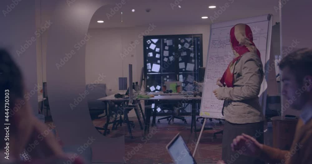 Businesswoman in wheelchair having business meeting with team at modern office Businesswoman in wheelchair having business meeting with team at modern office