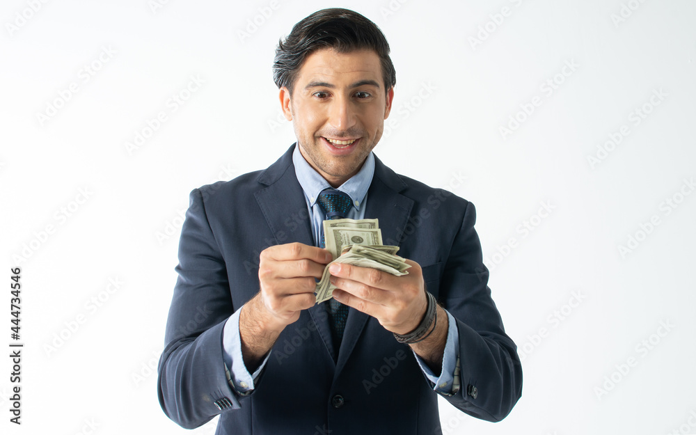Portrait handsome rich Caucasian male businessman wearing formal suit, counting dollar banknote money with excitement, making surprising and happy face, standing on isolated white background cutout. Portrait handsome rich Caucasian male businessman wearing formal suit, counting dollar banknote money with excitement, making surprising and happy face, standing on isolated white background cutout.