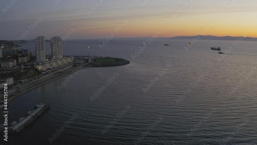 Evening view of the city coast from a drone. Evening view of the city coast from a drone.