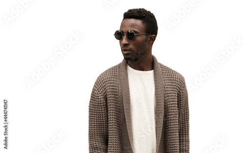 Portrait of stylish young african man model wearing a knitted cardigan isolated on a white background