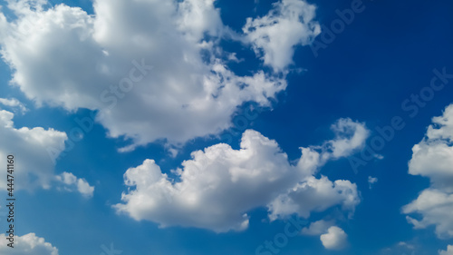 Fototapeta Naklejka Na Ścianę i Meble -  White cumulus clouds in the sky on a sunny summer day.