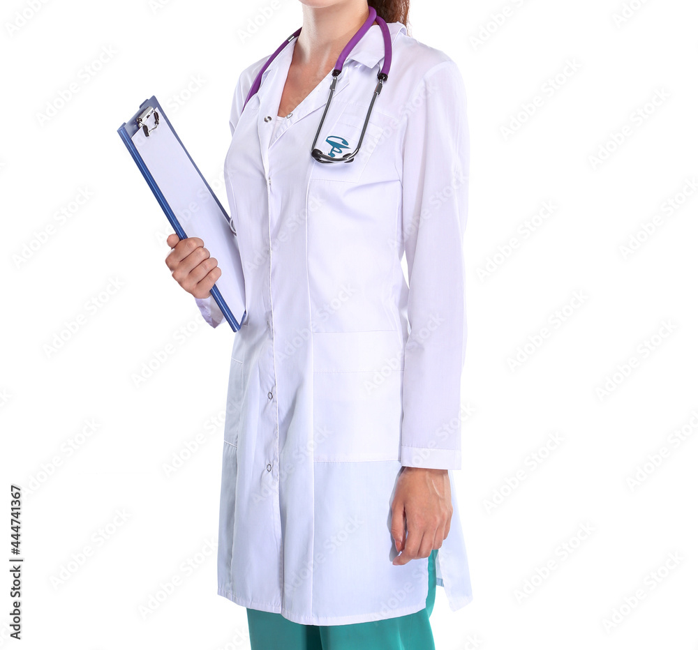 Smiling female doctor in uniform standing at hospital Smiling female doctor in uniform standing at hospital