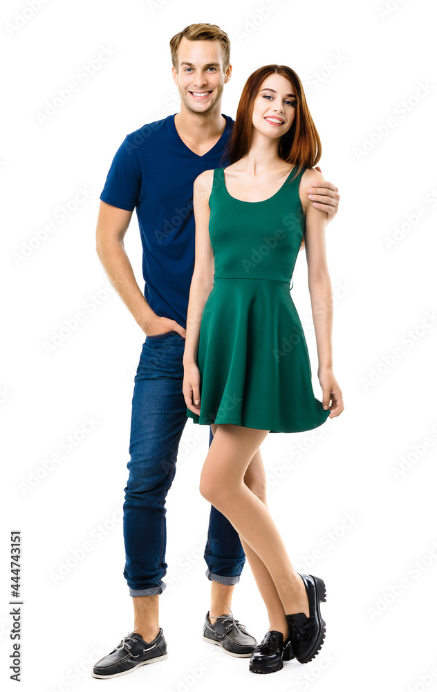 Image of smiling young couple. Full body length portrait of standing close and looking at camera models at happy in love studio concept, isolated on white background. Man and woman posing. Image of smiling young couple. Full body length portrait of standing close and looking at camera models at happy in love studio concept, isolated on white background. Man and woman posing.