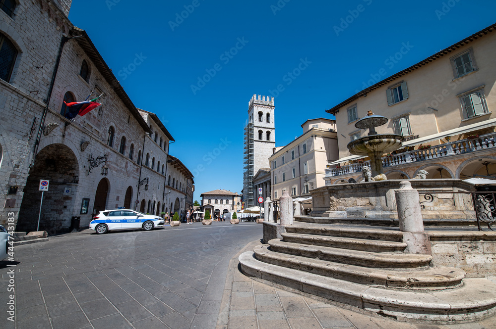 square of common in the center of assisi and tourists