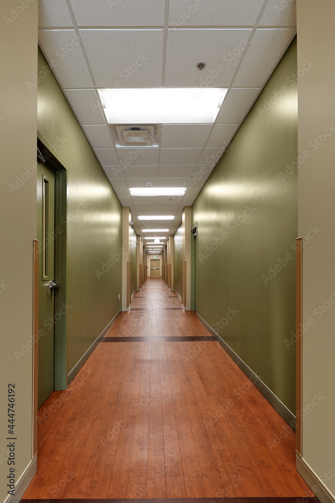Long hallway corridor with green walls in church business hotel