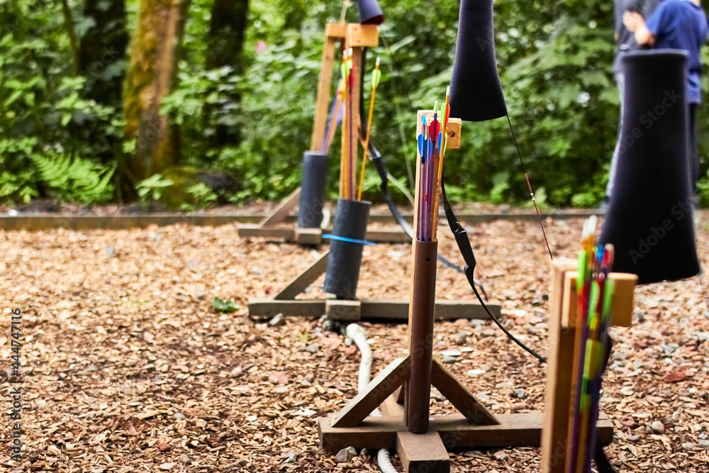 Quiver and bow stand in a line