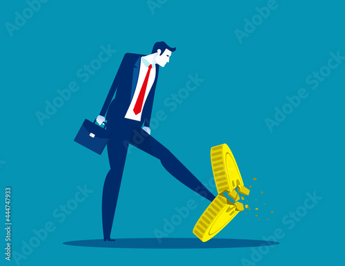 A businessman kicking a coin. Worthless coins
