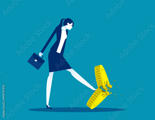 A businesswoman kicking a coin. Worthless coins