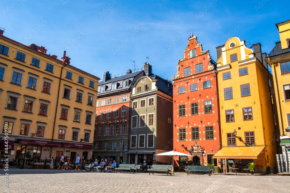Stockholm Sweden - July 1 2021: Colourful historic buildings and houses in Gamla Stan, Main S. Romantic medieval city centre alleys. Popular tourist destination in Scandinavia on a sunny day. Stockholm Sweden - July 1 2021: Colourful historic buildings and houses in Gamla Stan, Main S. Romantic medieval city centre alleys. Popular tourist destination in Scandinavia on a sunny day.