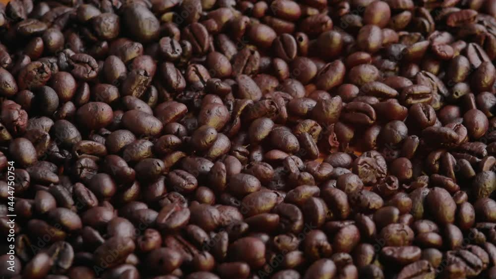 Roasted Coffee Beans falling is background. Organic coffee seeds. Roasted Coffee Beans falling is background. Organic coffee seeds.