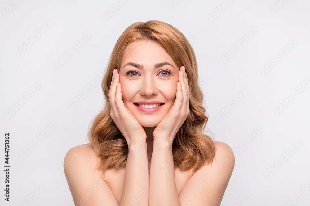 Photo portrait woman with blonde hair touching cheeks smiling happy isolated white color background Photo portrait woman with blonde hair touching cheeks smiling happy isolated white color background