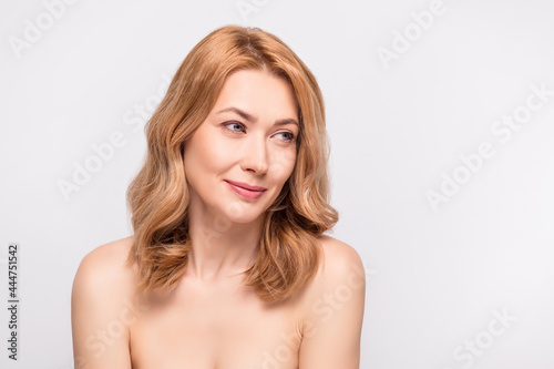 Photo portrait woman looking copyspace with nude shoulders isolated white color background