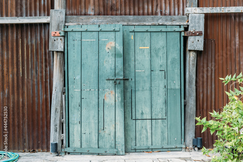 Vintage door on a brown wall.