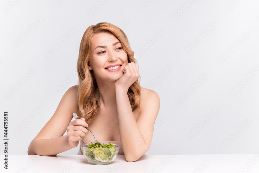 Portrait of attractive cheerful woman eating delicious salad fit gourment isolated over grey pastel color background Portrait of attractive cheerful woman eating delicious salad fit gourment isolated over grey pastel color background
