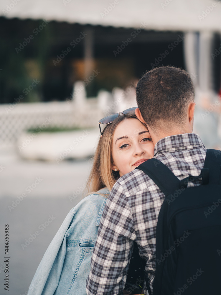 A happy young couple, hugs