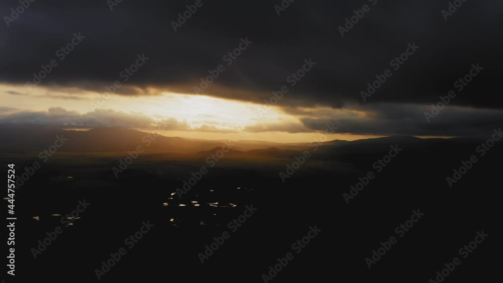 A view from a drone of a beautiful sunset in the valleys with the river A view from a drone of a beautiful sunset in the valleys with the river