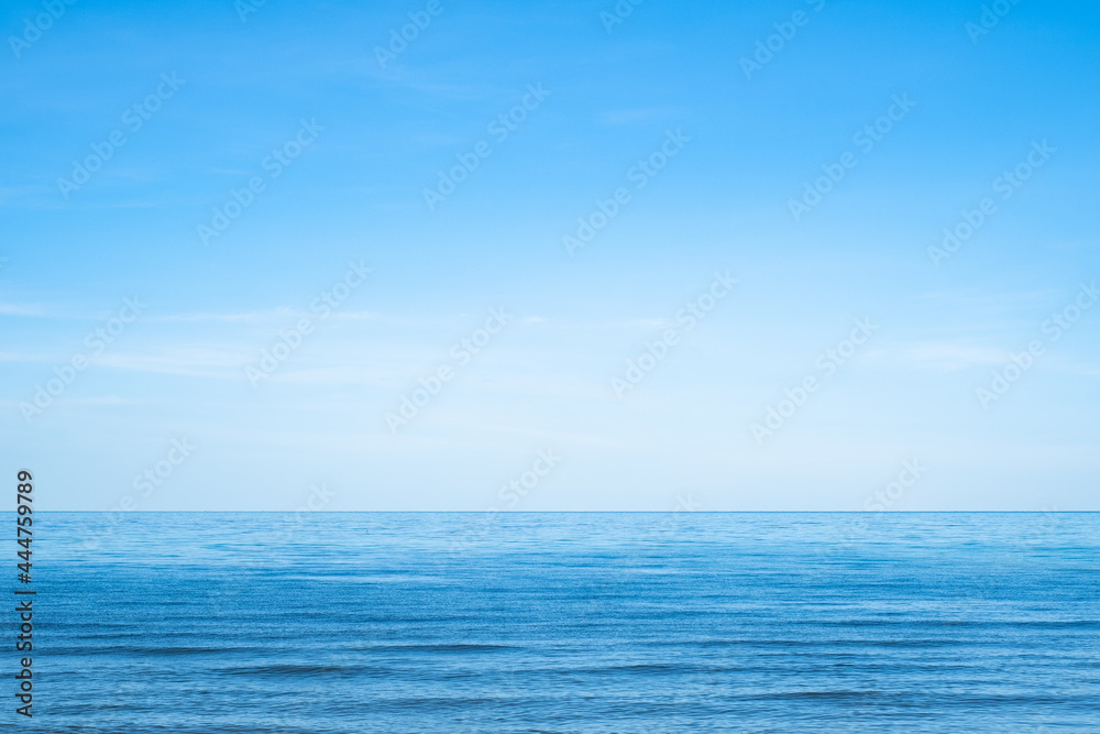 beautiful sea beach with small wave and clear blue sky. Summer holiday vacation background concept.