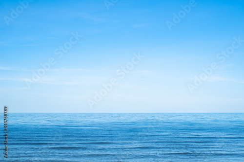 beautiful sea beach with small wave and clear blue sky. Summer holiday vacation background concept. © Bordinthorn