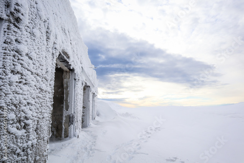 Old abandoned station in the mountains in winter. Ukrainian Carpathian Mountains.