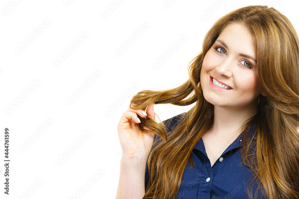 Woman with long hair shows healthy ends