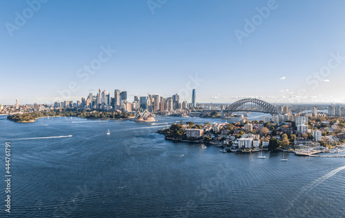 Stunning wide angle panoramic aerial drone view of the City of Sydney, Australia skyline with Harbour Bridge and Kirribilli suburb in foreground. Photo shot in May 2021, showing newest skyscrapers. photo