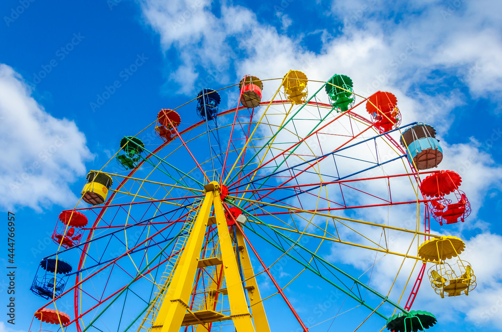 Ferris wheel in the park in summer. Ferris wheel in the park in summer.