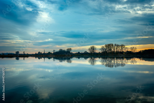 Evening blue clouds over a calm lake