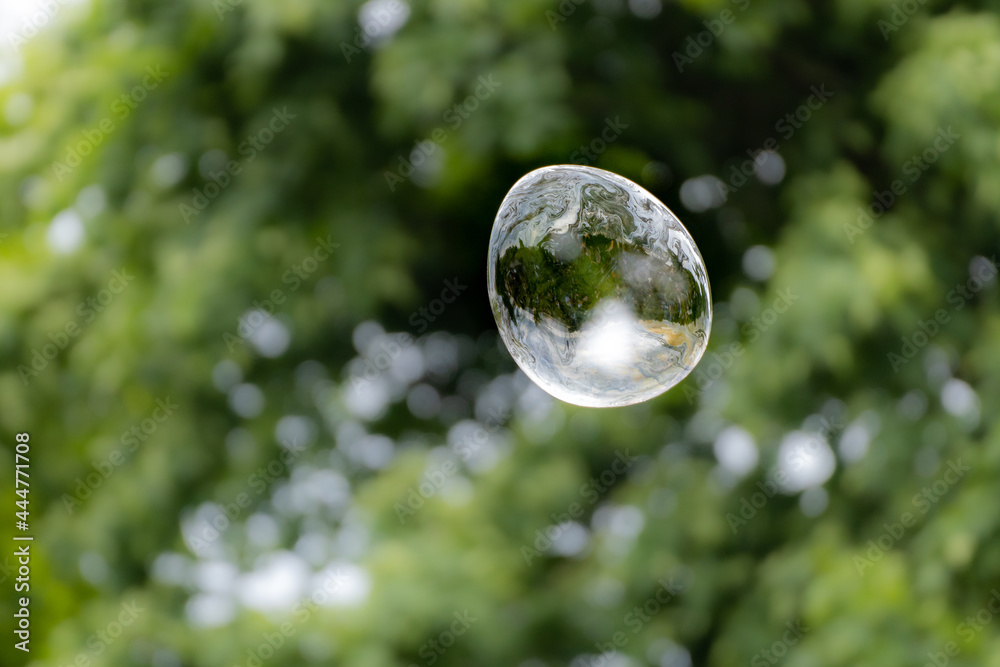 Releasing huge colorful soap bubbles in the open air Releasing huge colorful soap bubbles in the open air