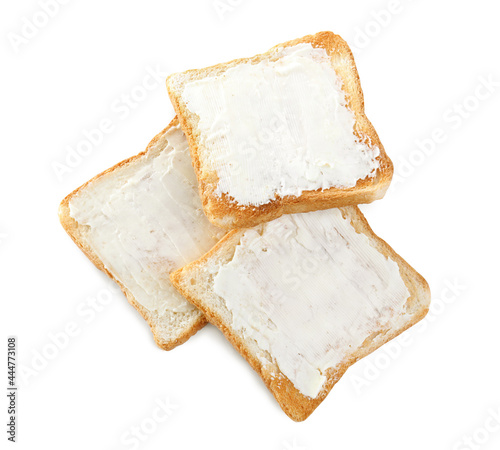 Delicious toasts with butter on white background, top view