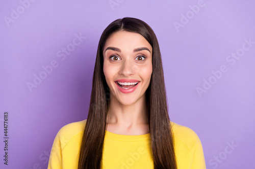 Portrait of attractive cheerful amazed long-haired girl good mood having fun isolated over violet purple color background