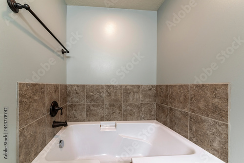 Εκτύπωση καμβά Bathroom interior with drop in tub with brown tile surround