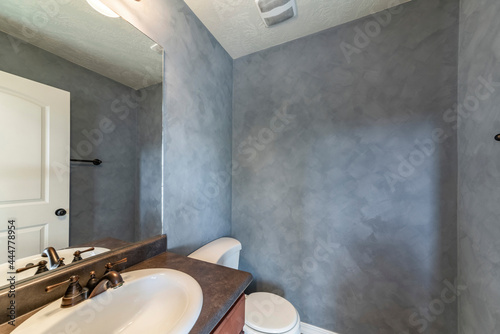 Small bathroom interior with faux paint concrete wall photo