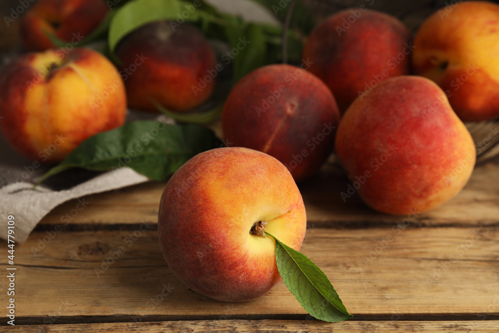 Fresh ripe juicy peaches on wooden table, closeup Fresh ripe juicy peaches on wooden table, closeup