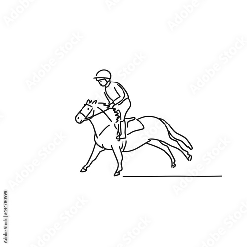 Pony riding - young equestrian is riding on a horse