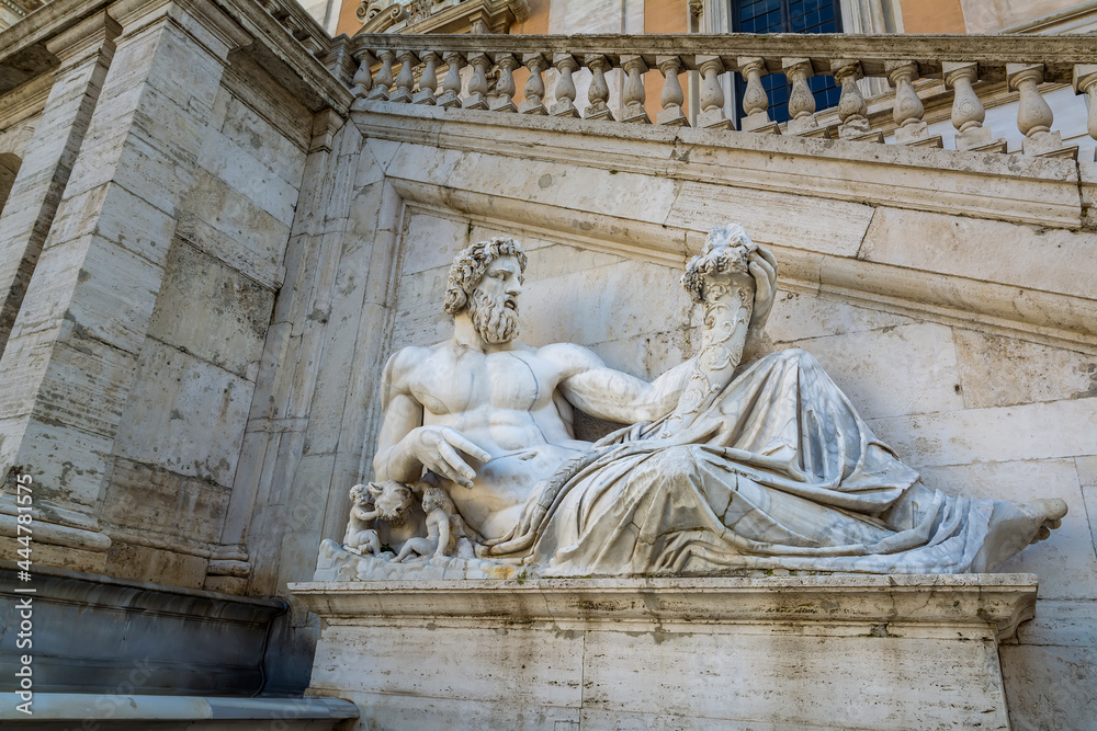 Statue of Tiberinus in front of the Palazzo Senatorio (Senatorial Palace) at the Piazza del Campidoglio in Rome, Italy