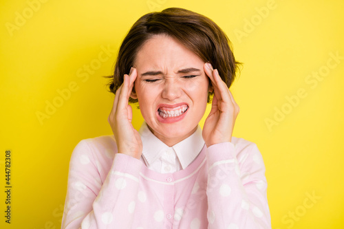Photo of young girl hands touch head headache pain suffer sick isolated over yellow color background