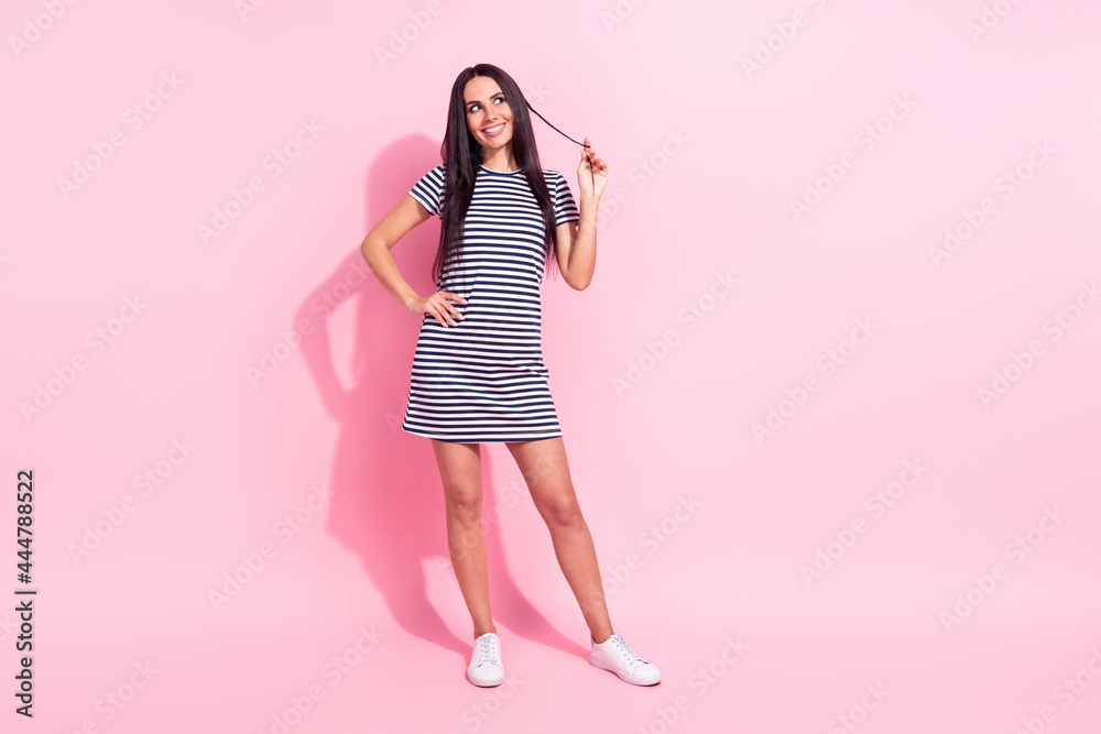 Full length body size view of attractive cheerful curious woman posing thinking isolated over pink pastel color background Full length body size view of attractive cheerful curious woman posing thinking isolated over pink pastel color background