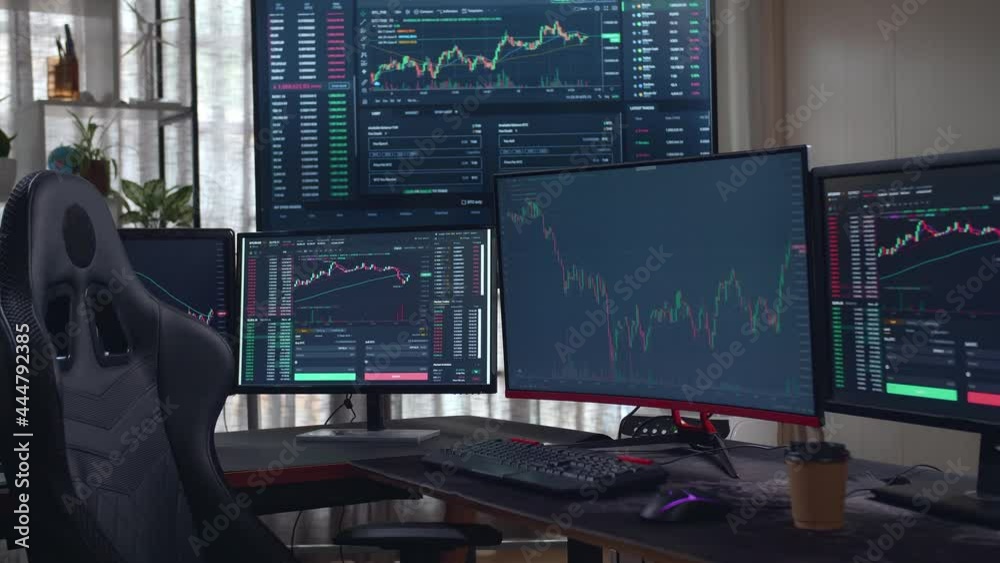 Stock Market Trader Multiple Computer Monitors With Financial Charts
